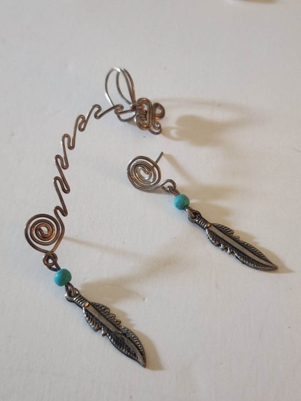 a pair of silver-toned wire-wrapped earrings
